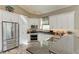 Modern kitchen with stainless steel appliances and granite countertops at 11120 Sanctuary Dr, Bradenton, FL 34209