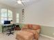 Home office with a comfortable seating area and a workspace at 11120 Sanctuary Dr, Bradenton, FL 34209