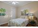 Guest bedroom with hardwood floors and a ceiling fan at 11439 Savannah Lakes Dr, Parrish, FL 34219