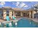 Inviting pool and spa with a covered patio at 11439 Savannah Lakes Dr, Parrish, FL 34219