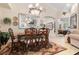 Formal dining room with a wood table and chandelier at 12116 Maple Ridge Dr, Parrish, FL 34219