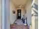 Inviting home entrance featuring tiled floors, neutral paint and decor, and a ceiling fan at 13005 Rinella St, Venice, FL 34293