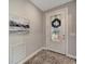 Bright and airy entryway with a beautiful glass door and neutral decor at 13005 Rinella St, Venice, FL 34293