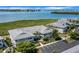 Aerial view of waterfront condo community with parking and lush landscaping at 1333 Perico Pointe Cir, Bradenton, FL 34209