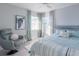 Serene bedroom with a plush bed and a comfortable armchair at 1333 Perico Pointe Cir, Bradenton, FL 34209