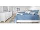 Spacious Primary bedroom with white dresser and en-suite bathroom at 1333 Perico Pointe Cir, Bradenton, FL 34209