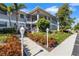 Condo building exterior showcasing walkway, landscaping, and parking area at 1333 Perico Pointe Cir, Bradenton, FL 34209