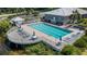 Community pool with deck, lounge chairs, and nearby clubhouse at 1333 Perico Pointe Cir, Bradenton, FL 34209