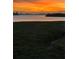 Stunning sunset over calm water and mangrove landscape at 1333 Perico Pointe Cir, Bradenton, FL 34209
