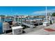 Several pontoon boats are docked at the marina, ready for use at 156 N Blvd Of The Presidents, Sarasota, FL 34236