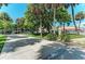 Scenic plaza with palm trees and walking paths at 156 N Blvd Of The Presidents, Sarasota, FL 34236