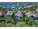 Aerial view of house with pool and cabana at 16333 Daysailor Trl, Lakewood Ranch, FL 34202