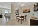 Bright dining area with glass table and four chairs at 16706 Vardon Ter # 401, Bradenton, FL 34211