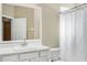 Clean bathroom with white vanity, shower/tub combo, and updated fixtures at 1800 Scarlett Ave, North Port, FL 34289