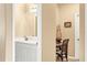 Double vanity bathroom with a small sitting area at 1800 Scarlett Ave, North Port, FL 34289