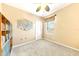 Bedroom with built-in shelving, a ceiling fan, and neutral wall colors at 1800 Scarlett Ave, North Port, FL 34289