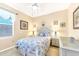 Bedroom with a queen-size bed, coastal decor and ceiling fan at 1800 Scarlett Ave, North Port, FL 34289