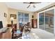 Home office with built-in desk and sliding glass doors leading to the backyard at 1800 Scarlett Ave, North Port, FL 34289