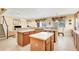 Spacious kitchen featuring an island, ample cabinetry, and modern appliances at 1800 Scarlett Ave, North Port, FL 34289