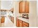 Kitchen with oak cabinets, granite countertops and black appliances at 1800 Scarlett Ave, North Port, FL 34289