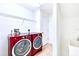 Convenient laundry room with washer, dryer, and utility sink at 1800 Scarlett Ave, North Port, FL 34289