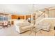 Open concept living room and kitchen with hardwood floors and light colored sofas at 1800 Scarlett Ave, North Port, FL 34289