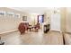 Living room with leather furniture, hardwood floors and a half wall at 1800 Scarlett Ave, North Port, FL 34289