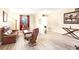 Living room featuring hardwood floors, leather furniture and entryway at 1800 Scarlett Ave, North Port, FL 34289