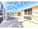Inviting pool area with screened enclosure and patio at 1800 Scarlett Ave, North Port, FL 34289