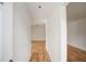 Bright hallway with light wood flooring leading to other rooms at 208 36Th W St, Bradenton, FL 34205