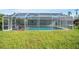 Clean lines of a refreshing pool with a screened enclosure at 208 36Th W St, Bradenton, FL 34205