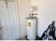 Garage with water heater and door to house at 25692 Aysen Dr, Punta Gorda, FL 33983