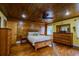 Bedroom with wood floors and wood paneled walls at 2690 Temple St, Sarasota, FL 34239