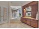 Bathroom featuring vanity with granite countertop, soaking tub, and large windows with natural light at 3408 Founders Club Dr, Sarasota, FL 34240