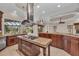 Bright kitchen with stainless steel range, granite countertops, and outdoor views at 3408 Founders Club Dr, Sarasota, FL 34240