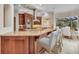 Gourmet kitchen featuring custom cabinetry, granite countertops, and modern stainless steel appliances at 3408 Founders Club Dr, Sarasota, FL 34240