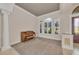 Bright living space with large windows and an upright piano at 3408 Founders Club Dr, Sarasota, FL 34240