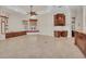 Open-concept living space with custom cabinetry and a large window seat at 3408 Founders Club Dr, Sarasota, FL 34240