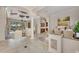 Bright open floor plan with elegant columns and access to outdoor living spaces at 3408 Founders Club Dr, Sarasota, FL 34240