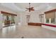 Open living room featuring tile floors and a fireplace at 3408 Founders Club Dr, Sarasota, FL 34240