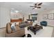 Inviting living room with leather sofa, plush rug, pool table, and ample natural light at 3408 Founders Club Dr, Sarasota, FL 34240