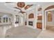 The living room features a fireplace, custom ceiling, and plenty of natural light at 3408 Founders Club Dr, Sarasota, FL 34240