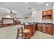 Entertainment space includes a wet bar and built-in shelving at 3408 Founders Club Dr, Sarasota, FL 34240