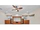 Cozy living room featuring custom built-in cabinets, recessed lighting, and a ceiling fan at 3408 Founders Club Dr, Sarasota, FL 34240