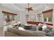Stylish living room with access to outdoor patio, fireplace, and comfortable seating at 3408 Founders Club Dr, Sarasota, FL 34240