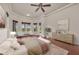 Bright main bedroom with bay windows and a view of the backyard at 3408 Founders Club Dr, Sarasota, FL 34240