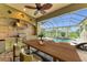 The outdoor kitchen is perfect for entertaining and poolside enjoyment at 3408 Founders Club Dr, Sarasota, FL 34240