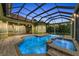 Enjoy swimming in the pool and relaxing in the hot tub in this backyard retreat at 3408 Founders Club Dr, Sarasota, FL 34240