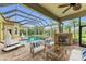 Enjoy the poolside fireplace and hot tub in this backyard oasis at 3408 Founders Club Dr, Sarasota, FL 34240