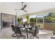 Relaxing screened patio with seating and backyard view at 4028 Dover E Dr, Bradenton, FL 34203